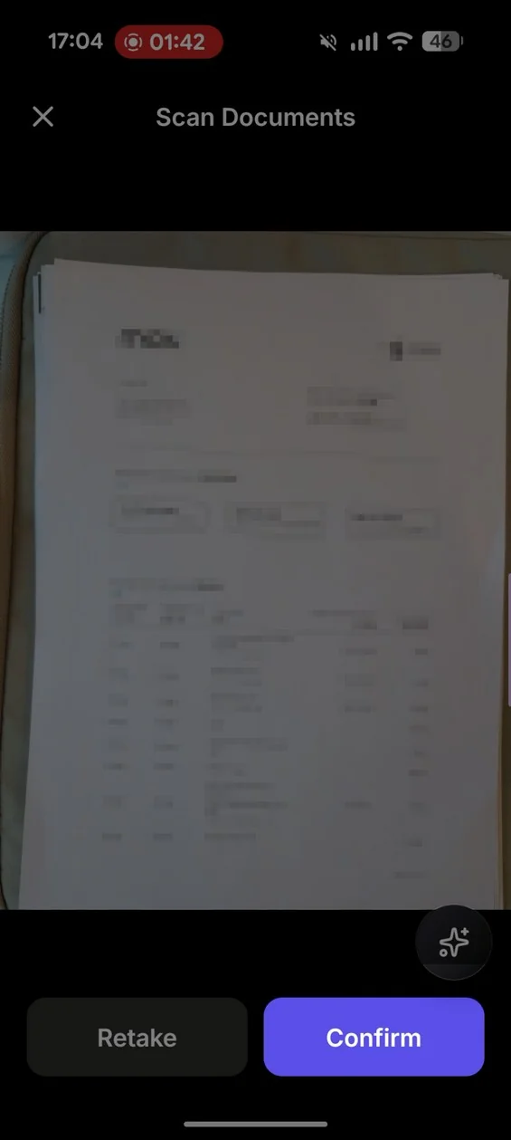 Document scanning interface showing a preview of a document with Retake and Confirm buttons