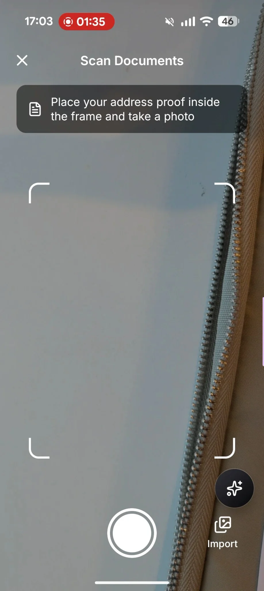 Mobile app interface for scanning documents, showing a camera view with a frame, a shutter button, and an import option